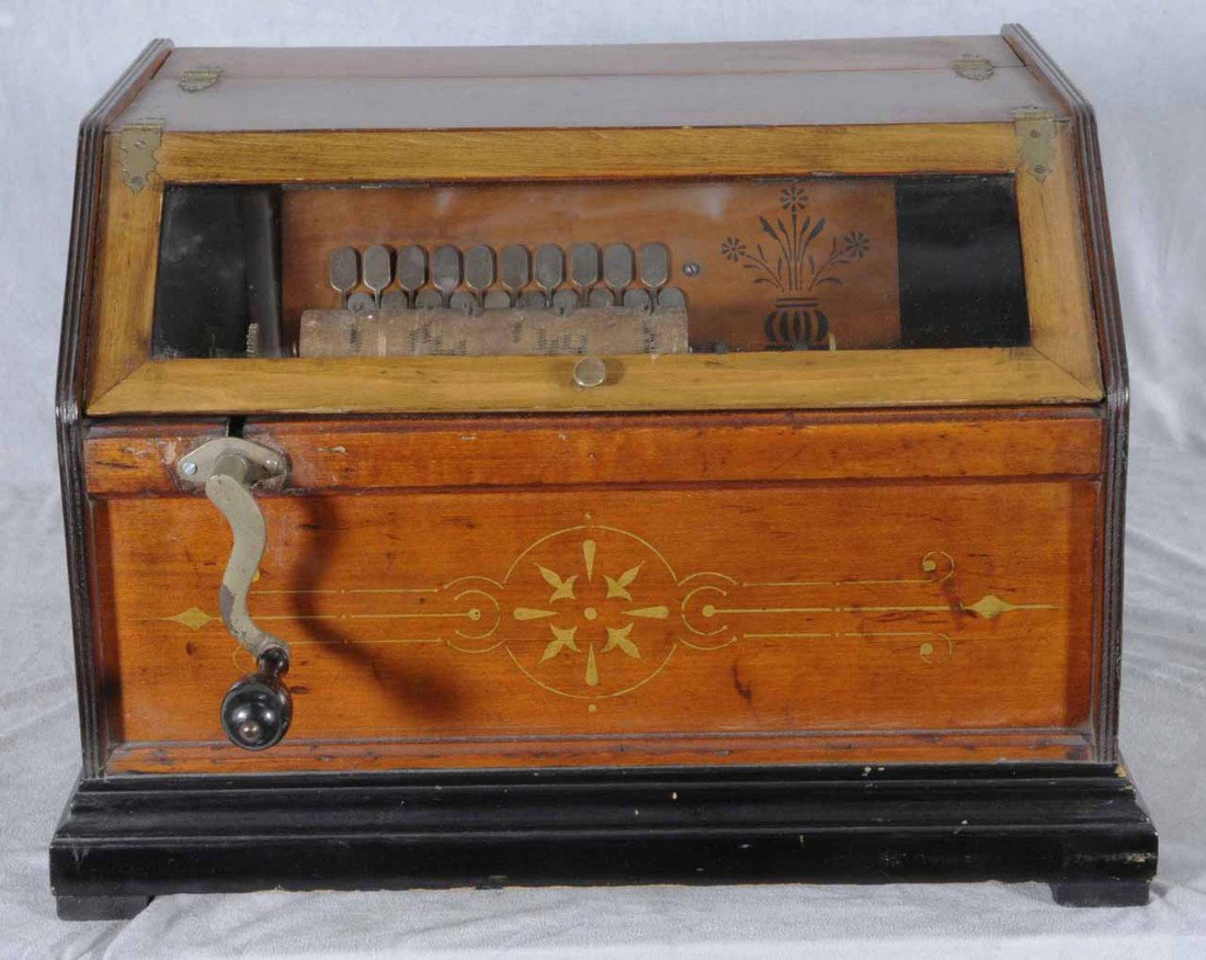 ANTIQUE "CHANTANGUA ROLLER ORGAN". FRUITWOOD CASE W/: ANTIQUE "CHANTANGUA ROLLER ORGAN". FRUITWOOD CASE W/ GLASS WINDOW. EXTRA ROLLS. 12 1/2" H X 18" W X 15" D.