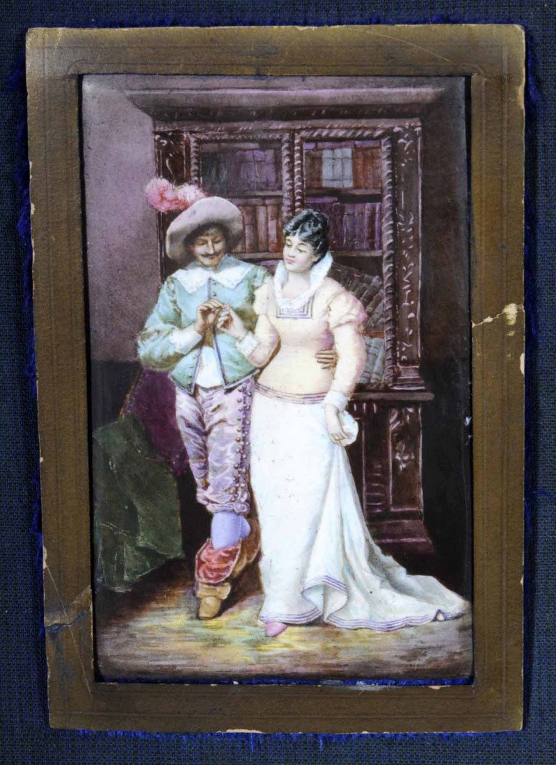ANTIQUE FRENCH LIMOGES ENAMEL PLAQUE OF A COUPLE I: ANTIQUE FRENCH LIMOGES ENAMEL PLAQUE OF A COUPLE IN PERIOD ATTIRE. FRAMED. 3 3/4" H X 2 3/8" W PLAQ. FRAME 9 1/2" H X 7 1/2" W.