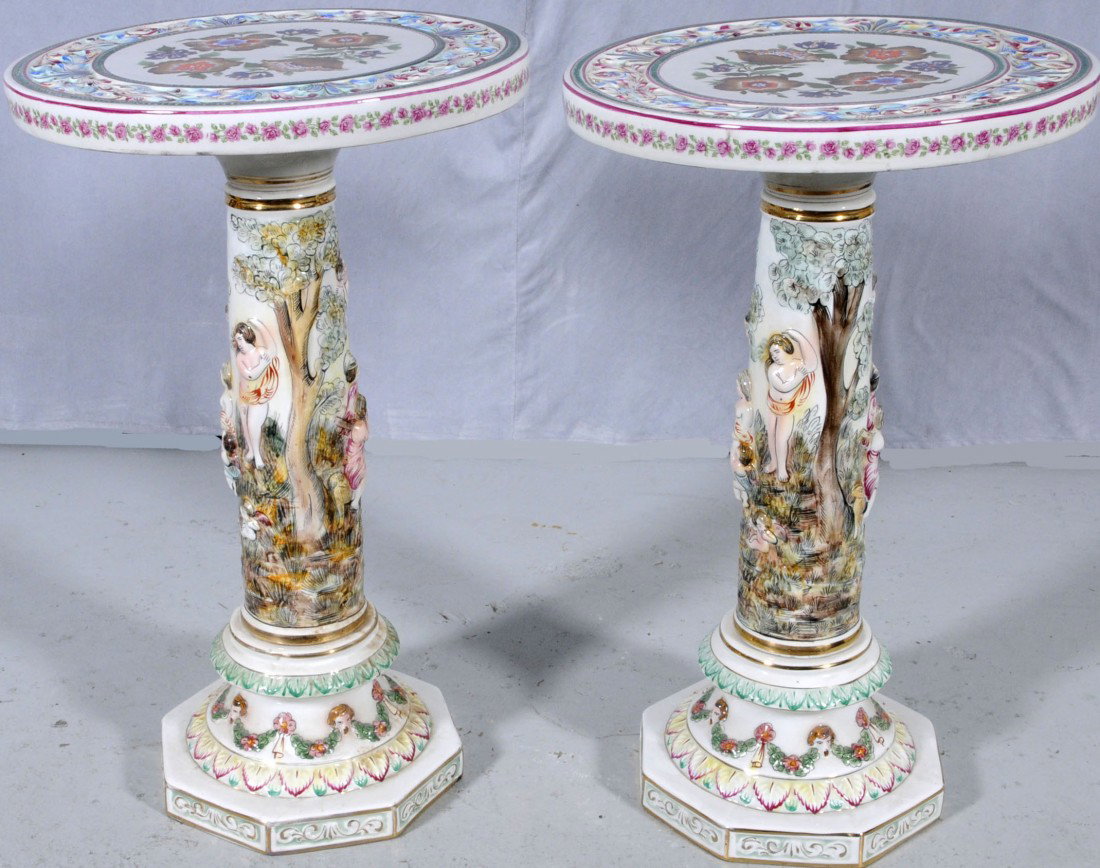 PR. OF ITALIAN CAPO DI MONTE SIDE TABLES. FLORAL DE: PR. OF ITALIAN CAPO DI MONTE SIDE TABLES. FLORAL DESIGN TOPS & BASES. FIGURAL DECORATED COLUMNS. 26 1/2" H X 16 1/2" DIA.