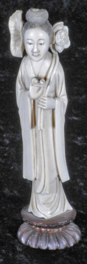 CHINESE CARVED IVORY FIGURE OF KUAN YIN HOLDING FLO: CHINESE CARVED IVORY FIGURE OF KUAN YIN HOLDING FLOWERS. 6 1/2" H