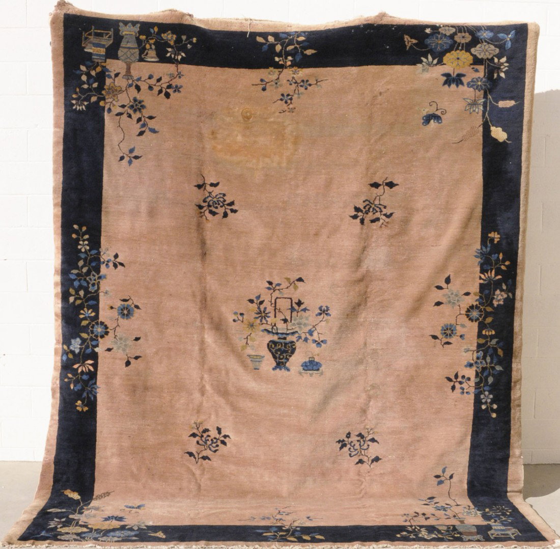 PEKING CHINESE BROWN CARPET. APP. 9' X 11' 5". BLU: PEKING CHINESE BROWN CARPET. APP. 9' X 11' 5". BLUE VASES & FLOWERS IN THE FIELD W/ FLORAL & BLUE BORDERS. 9' X 11' 5"