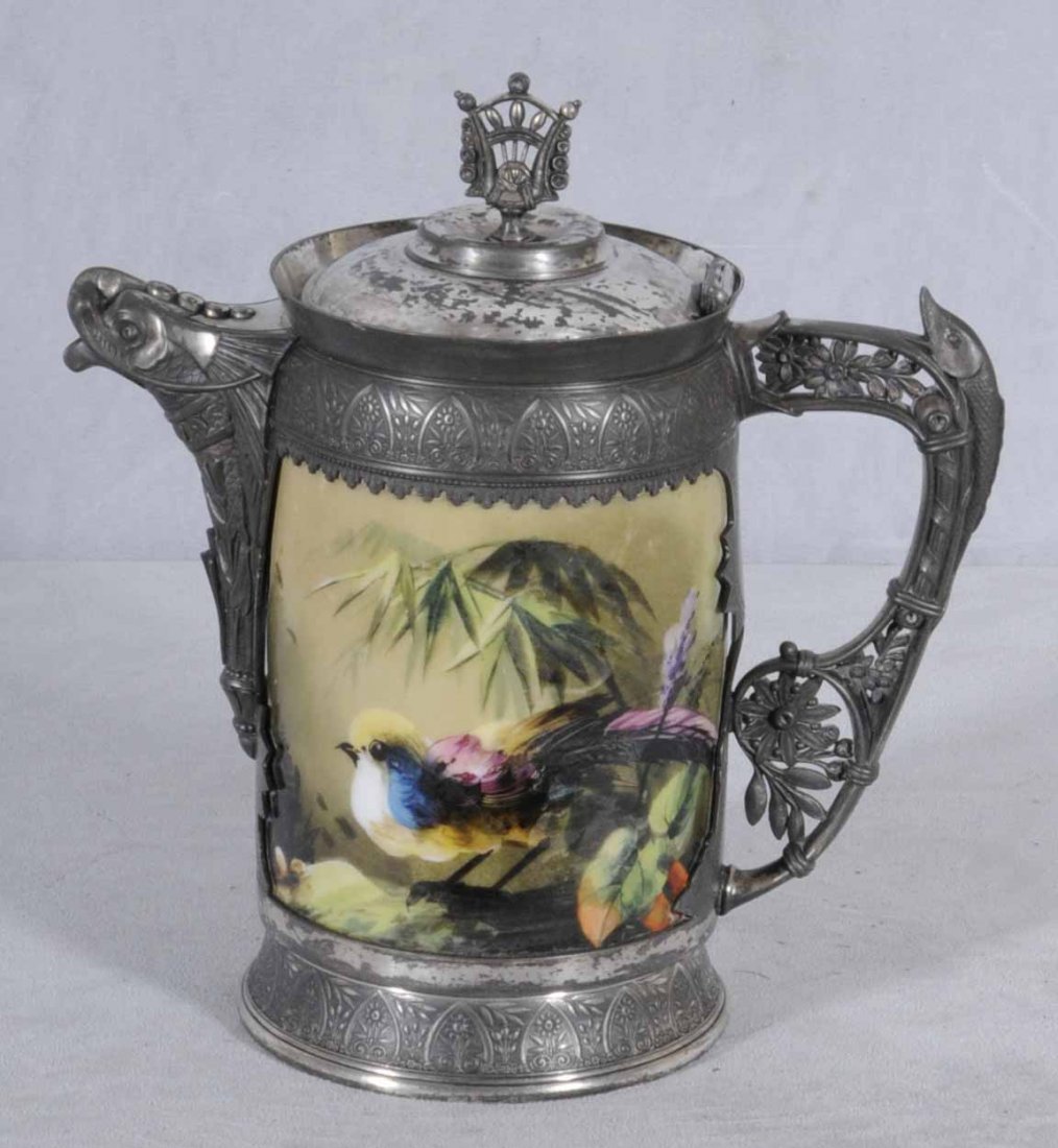 ANTIQUE VICTORIAN PORCELAIN & S.P. PITCHER WITH BIR: ANTIQUE VICTORIAN PORCELAIN & S.P. PITCHER WITH BIRD DECORATION. MAKER; SIMPSON, HALL & MILLER CO. 13" H X 12" W
