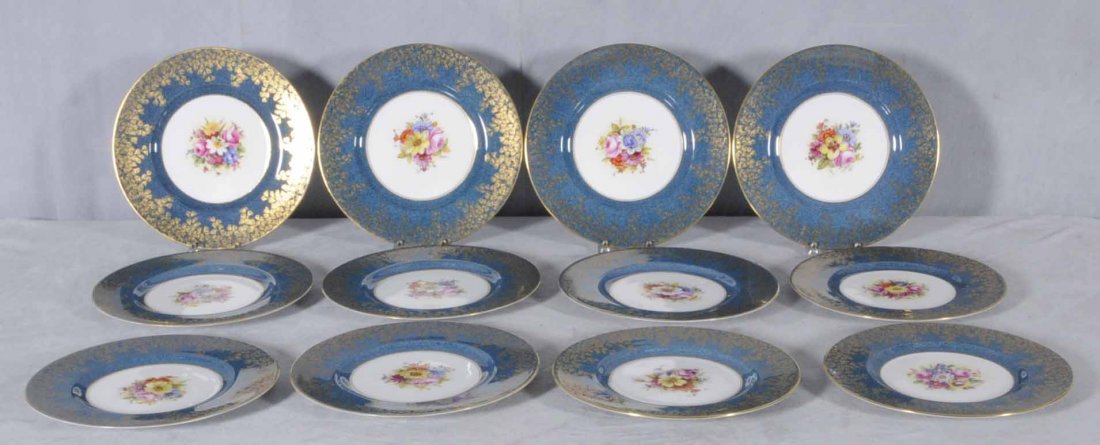 12 ROYAL WORCESTER SERVICE PLATES. ROBIN EGG BLUE B: 12 ROYAL WORCESTER SERVICE PLATES. ROBIN EGG BLUE BORDER W/ GILT LEAVES AND MULTI-COLOR FLORAL ENAMEL CENTERS. ALL HAVE DIFFERENT FLORAL CENTERS. ALL SIGNED. 2 DIFFERENT MARKS. 10 1/4 " DIA. (TK)