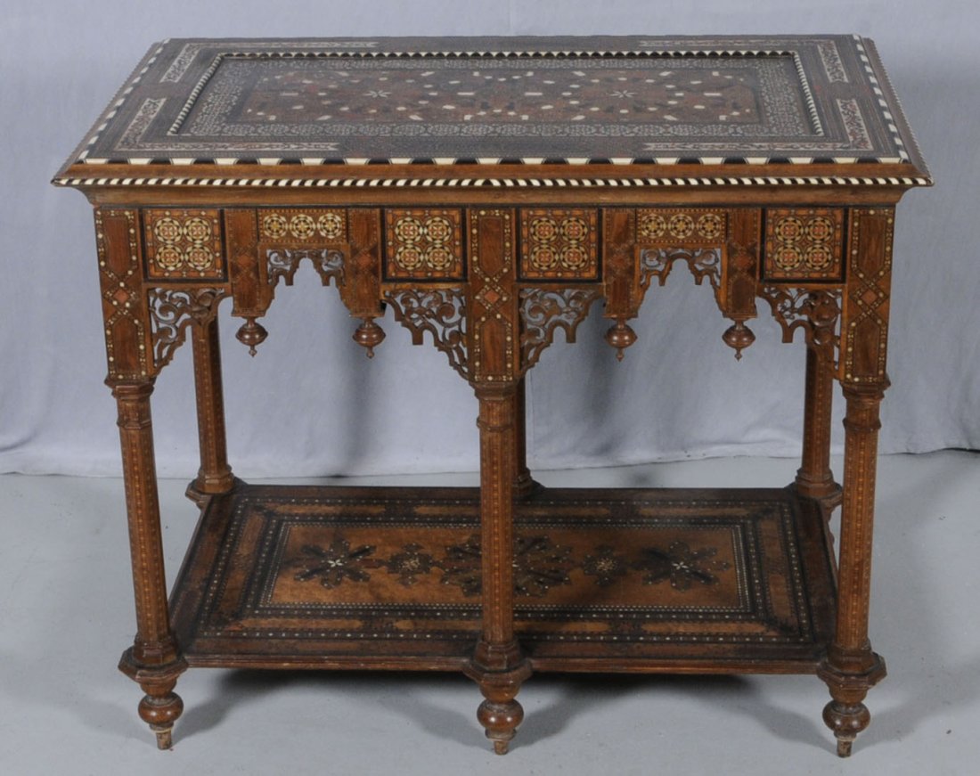 ANTIQUE FRENCH MOROCCAN FINELY INLAID TABLE. BONE,: ANTIQUE FRENCH MOROCCAN FINELY INLAID TABLE. BONE, M.O.P., EBONY & VARIOUS WOOD INLAY. GEOMETRIC DESIGNED TOP AND LOWER SHELF. BOULLE STYLE BANDING ON THE TOP. OCTAGONAL SHAPED LEG SUPPORTS. 30" H X 3