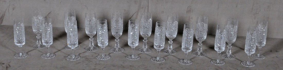 18 PC. CUT GLASS CHAMPAGNE FLUTES. 2 DIFFERENT PAT: 18 PC. CUT GLASS CHAMPAGNE FLUTES. 2 DIFFERENT PATTERNS. 7 1/8" H X 2 1/2" DIA - 6 7/8" H X 2 3/8" DIA
