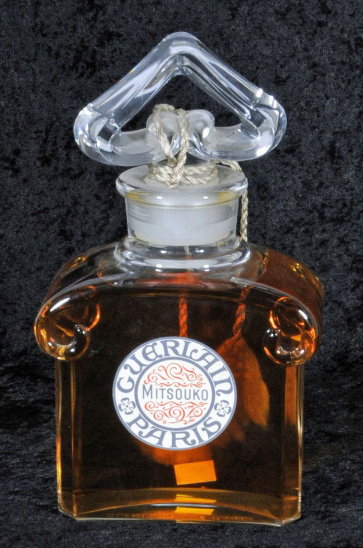 FRENCH GUERLAIN PARIS MITSOUKO PERFUME IN A FRENCH G: FRENCH GUERLAIN PARIS MITSOUKO PERFUME IN A FRENCH GLASS BOTTLE. 12" H X 6 3/4" W. (TK)