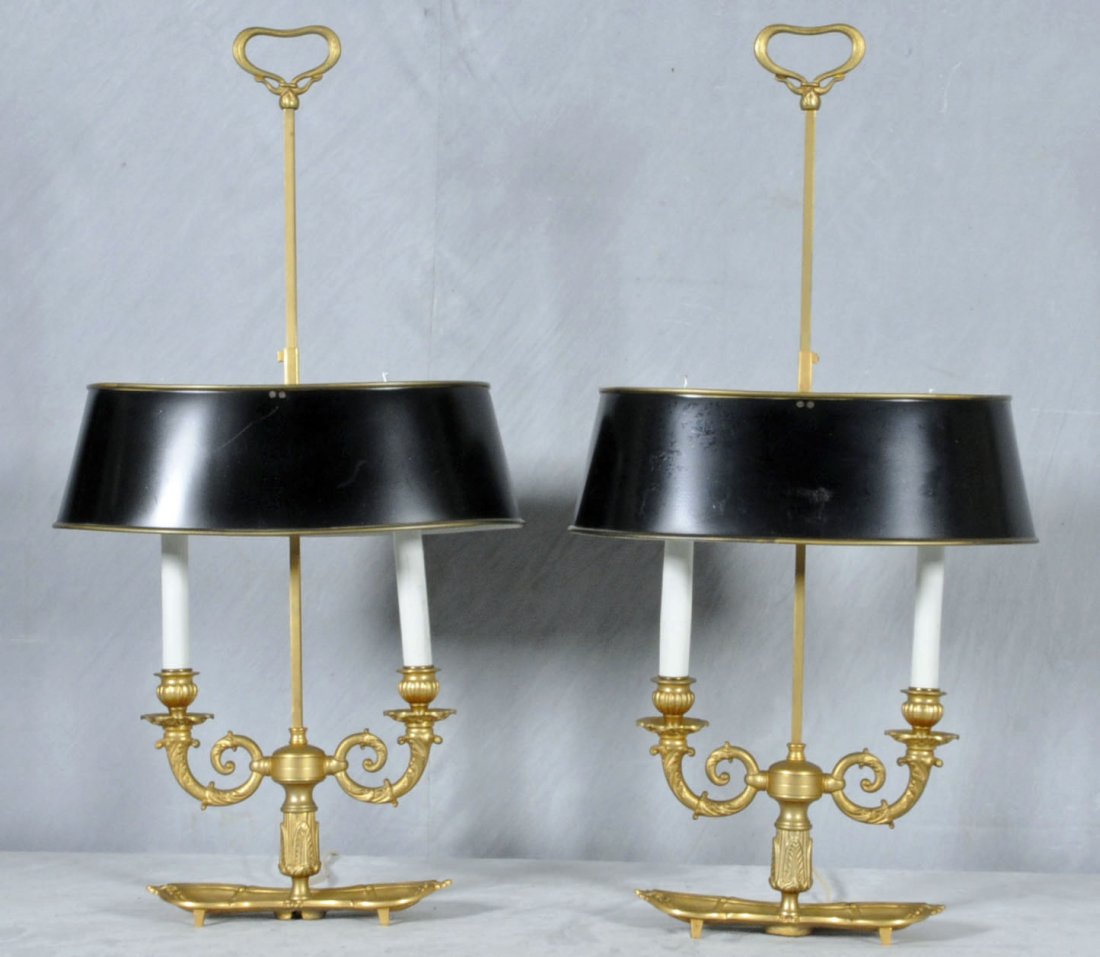 PR. BRONZE BOULLIOTTE 2 LIGHT LAMPS. SCROLLED ARMS: PR. BRONZE BOULLIOTTE 2 LIGHT LAMPS. SCROLLED ARMS W/ A SHAPED TRAY BASE AND BLACK TOLE SHADES. 28" H X 14 1/2" W. (TK)