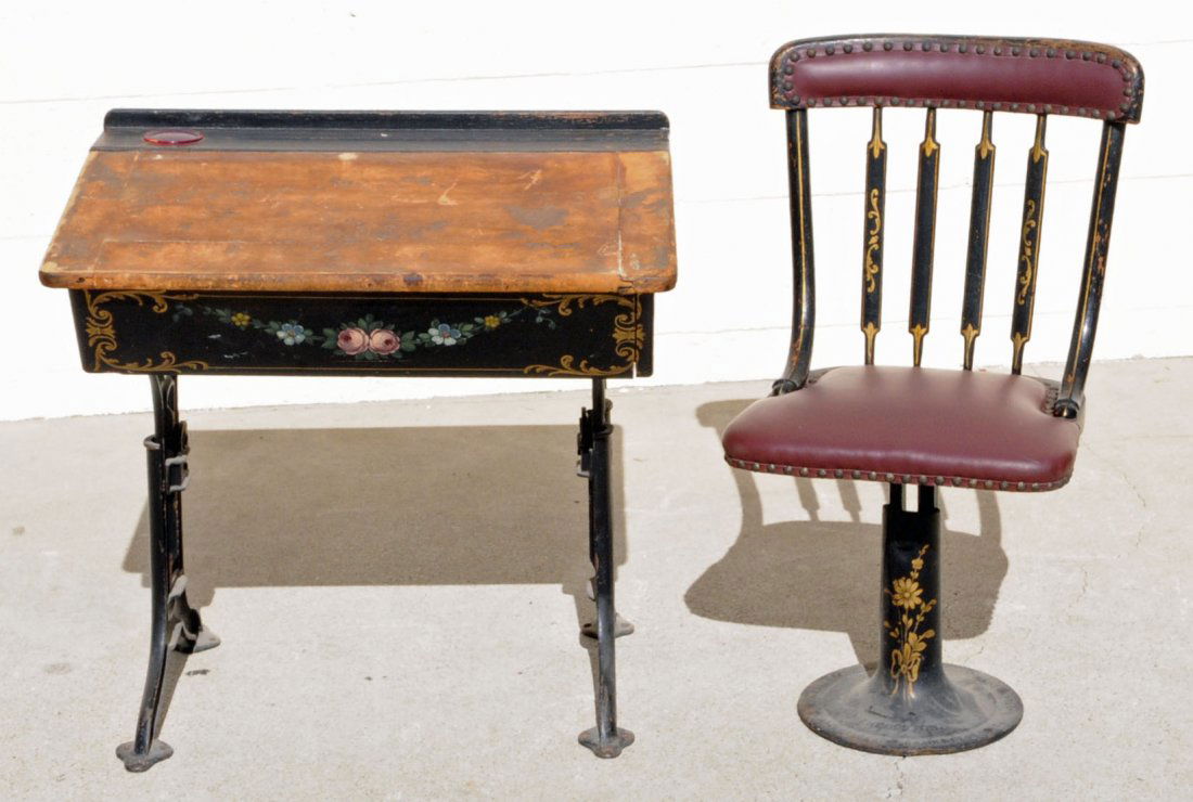 ANTIQUE WROUGHT IRON SCHOOL DESK & CHAIR. PAINTED: ANTIQUE WROUGHT IRON SCHOOL DESK & CHAIR. PAINTED FLORAL FINISH. DESK IS ADJUSTABLE. 25" H X 26" W X 19 1/2" D. (TK)