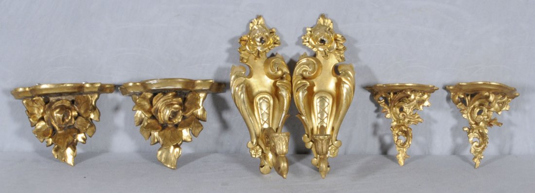3 PR. OF CARVED GILTWOOD WALL BRACKETS & SCONCES. C: 3 PR. OF CARVED GILTWOOD WALL BRACKETS & SCONCES. CONSISTING OF 2 PAIRS OF FLORAL DESIGN BRACKETS & A PAIR OF SINGLE LIGHT WALL SCONCES. 12" H X 4 3/4" W X 5" D. (TK)