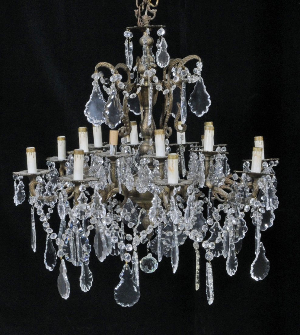 16 LIGHT FLORAL DECORATED ORMOLU CHANDELIER. SCROL: 16 LIGHT FLORAL DECORATED ORMOLU CHANDELIER. SCROLLED ARMS AND CUT GLASS PRISMS. 29" H X 29" DIA. (TK)