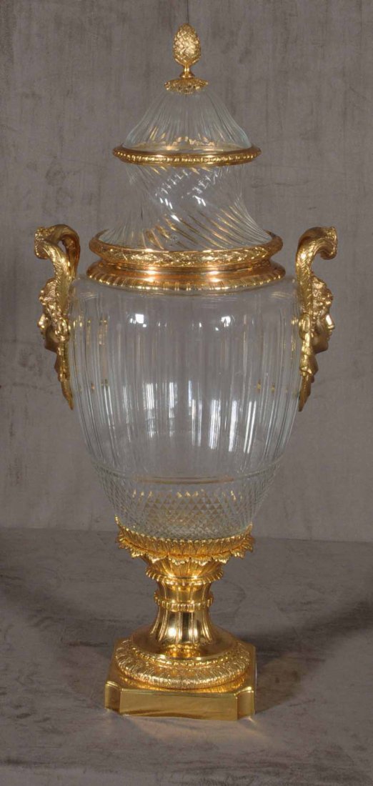 FRENCH SIGNED BACCARAT CRYSTAL VASE.: FRENCH SIGNED BACCARAT CRYSTAL VASE. CUT AND FLUTED DESIGN WITH DORE BRONZE MOUNTS. FACIAL HANDLES. 30 "H X 13" W.