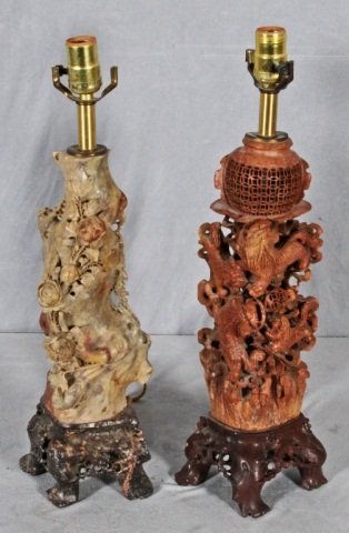 2 CARVED SOAPSTONE VASES MOUNTED AS LAMPS. 1 HAS O: 2 CARVED SOAPSTONE VASES MOUNTED AS LAMPS. 1 HAS OPEN WORK FOO DOG DECORATION & 1 HAS FLORAL DECORATION. GOOD. 16" H X 6" W & 16" H X 5" W. (AS)