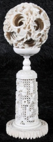 ORIENTAL CARVED IVORY CONCENTRIC BALL. MORE THAN : ORIENTAL CARVED IVORY CONCENTRIC BALL. MORE THAN 13 BALLS. RESTING ON AN OPENWORK BASE. GOOD. 7 1/4" H X 2 3/4" DIA. (AS)