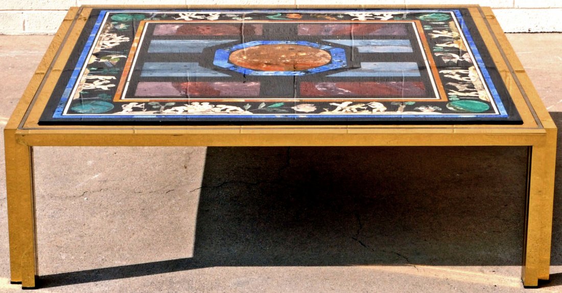 INLAID SCAGILIOLA COFFEE TABLE WITH MULTI COLORED: INLAID SCAGILIOLA COFFEE TABLE WITH MULTI COLORED FIGURAL & BIRD DECORATION. SET IN A BRASS TABLE. GOOD. 15" H X 49" SQ. (AS)