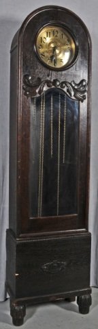 GERMAN OAK GRANDFATHER CLOCK WITH A BRASS FACE. CL: GERMAN OAK GRANDFATHER CLOCK WITH A BRASS FACE. CLOCK NOT WORKING. 76 1/4"H 21 1/2" W X 11" D. (TK)
