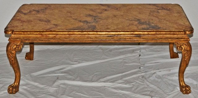 ITALIAN CARVED GILT WOOD COFFEE TABLE. FAUX MARBL: ITALIAN CARVED GILT WOOD COFFEE TABLE. FAUX MARBLE TOP W/ PAW FEET. GOOD. 19 1/2" H X 52" W X 28" D. (TK)