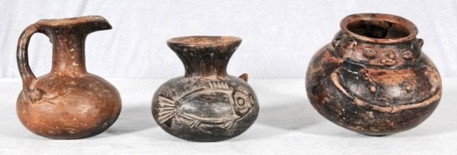 3 PRE-COLUMBIAN VESSLES. CONSISTING OF A PITCHER: 3 PRE-COLUMBIAN VESSLES. CONSISTING OF A PITCHER WITH A SNAKE HANDLE, A VASE WITH FISH DECORATION , AND A VASE WITH A FACIAL DESIGN. AS IS. TALLEST 7" H X 6" DIA.