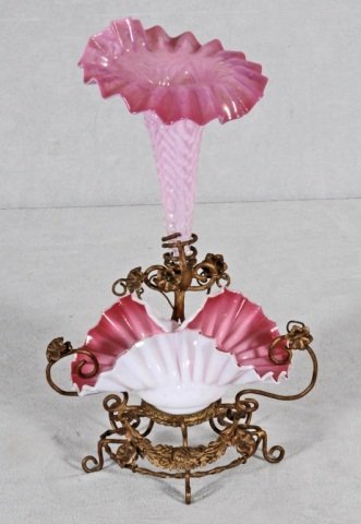 ANTIQUE VICTORIAN BRASS AND GLASS EPERGNE. PINK AN: ANTIQUE VICTORIAN BRASS AND GLASS EPERGNE. PINK AND WHITE CRIMPLED GLASS TRUMPET VASE AND A SHAPED BOWL. OPEN WORK BRASS BASE. GOOD. 12 1/2" H X 7 1/2" W X 6" D.