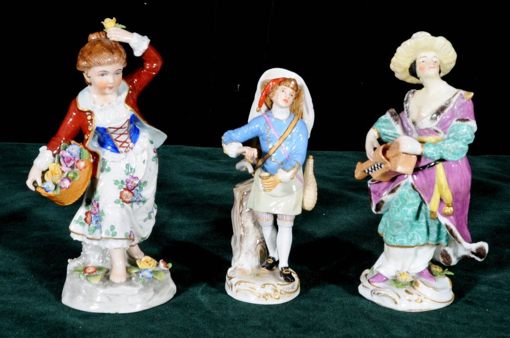 3 EUROPEAN PORCELAIN FIGURINES. 2 ARE FIGURES OF LADIES: 3 EUROPEAN PORCELAIN FIGURINES. 2 ARE FIGURES OF LADIES AND A FIGURE OF A YOUNG BOY. BOY HAS BLUE CROSSED SWORD MARK. GOOD. TL = 7" H. SM = 5 1/2" H.