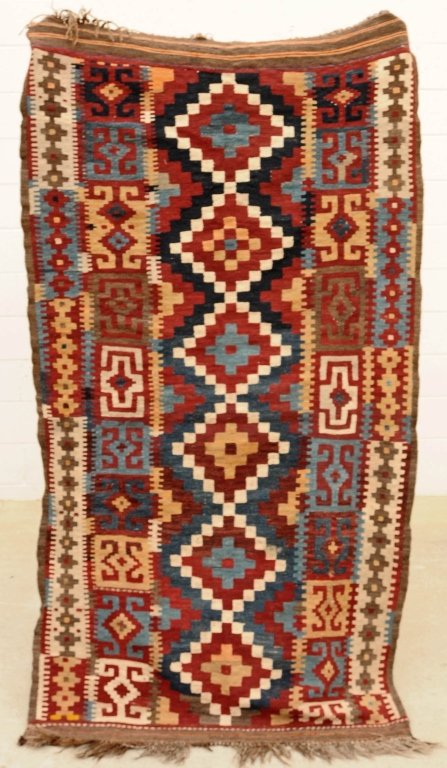 ANTIQUE KHILIM RED, BLUE AND BROWN THROW RUG. GEOMETE: ANTIQUE KHILIM RED, BLUE AND BROWN THROW RUG. GEOMETERIC DESIGN. GOOD. 3' 7" x 6' . FROM THE SANTA MONICA CONDOMINIUM OF LARRY HAGMAN, STAR OF "DALLAS" AND "I DREAM OF JEANNIE"