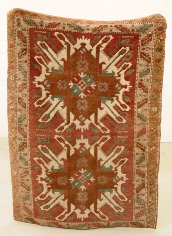 TURKISH ANATOLIAN CARPET. BROWN AND GREEN COLORING.: TURKISH ANATOLIAN CARPET. BROWN AND GREEN COLORING. WORN. 4' x 5' 9". FROM THE SANTA MONICA CONDOMINIUM OF LARRY HAGMAN, STAR OF "DALLAS" AND "I DREAM OF JEANNIE"