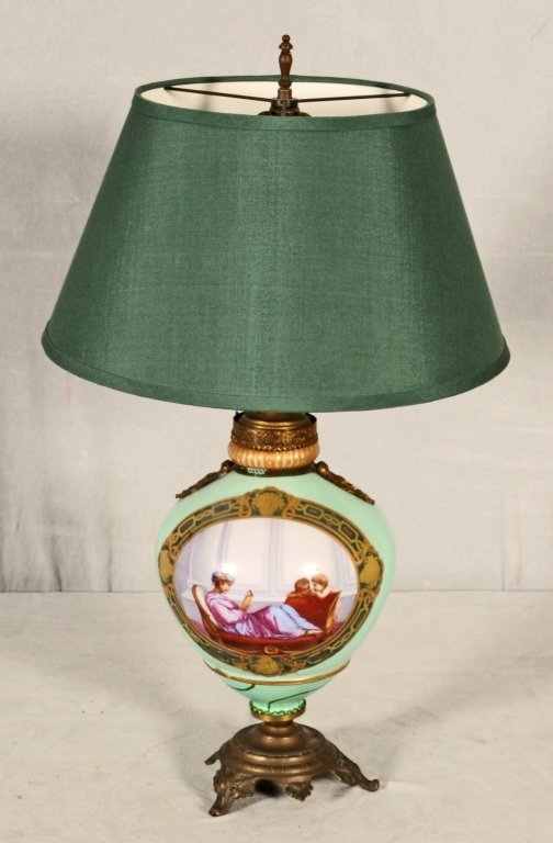 EUROPEAN PORCELAIN GREEN URN MOUNTED AS A LAMP. PAINTE: EUROPEAN GREEN PORCELAIN URN MOUNTED AS A LAMP. PAINTED PANEL OF PEOPLE. ORMOLU MOUNTS. BASE HAS BEEN REPAIRED. 14" H X 8" DIA.