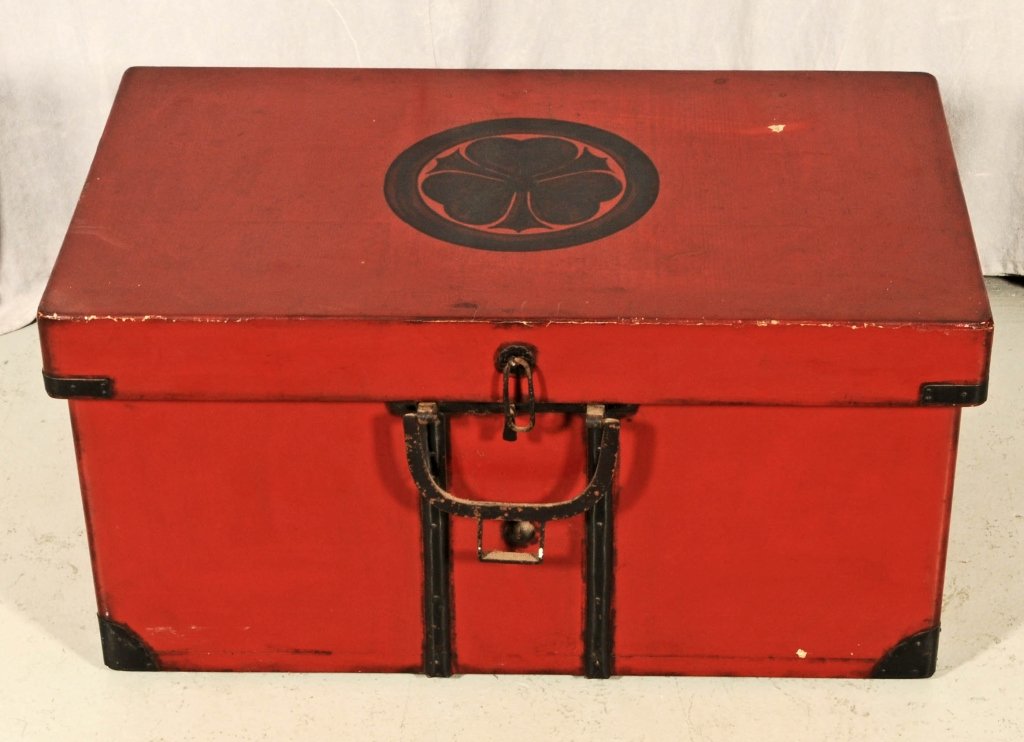 JAPANESE RED LACQUER STORAGE CHEST WITH AOI MON. LATE E: JAPANESE RED LACQUER STORAGE CHEST WITH AOI MON. LATE EDO/MEIJI PERIOD. SOME CHIPS. FINISH COMING OFF. 15" H X 28" W X 16" D.