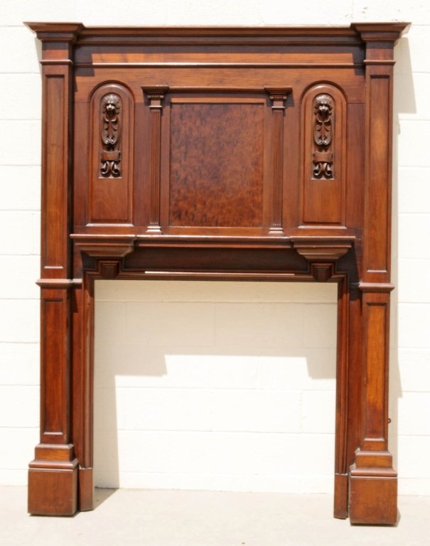19th C. CARVED AMERICAN MAHOGANY FIRE PLACE SURROUND AN: 19th C. CARVED AMERICAN MAHOGANY FIRE PLACE SURROUND AND OVERMANTEL. CARVED LION HEADS DECORATE THE OVER MANTEL. INSIDE 39 1/2" H X 41 1/2" W. GOOD. 82 1/2" H X 64 1/2" W X 8 1/2" D.