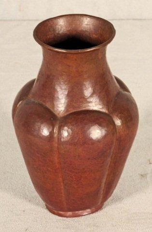 HAND HAMMERED COPPER VASE. STAMPED ON THE BOTTOM, WITH: HAND HAMMERED COPPER VASE. STAMPED ON THE BOTTOM, WITH A WINDMILL AND "D---NERP." GOOD. STAMP RUBBED. 7 1/4" H X 4 1/2" DIA.