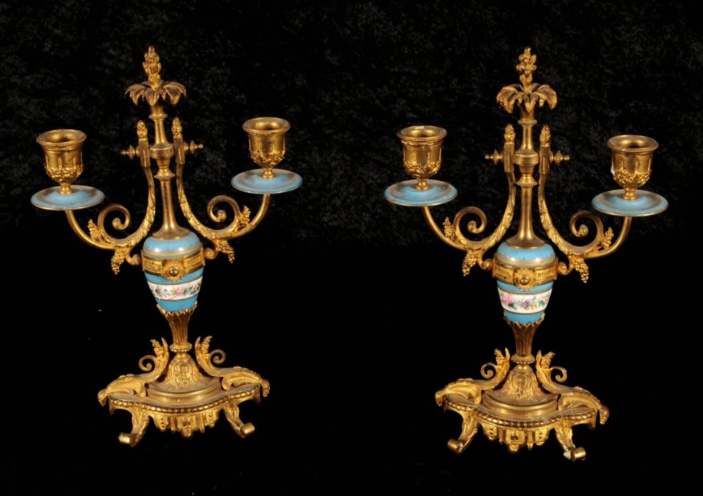 PR. FRENCH PORCELAIN & ORMOLU 2 LIGHT CANDELABRA.: PR. FRENCH PORCELAIN & ORMOLU 2 LIGHT CANDELABRA. SCROLLED ARMS AND BASES. LIGHT BLUE AND WHITE FLORAL DECORATED PORCELAIN URNS AND BOBECHES. GOOD. 11 1/2" H X 7 3/4"W X 3 1/2"D.