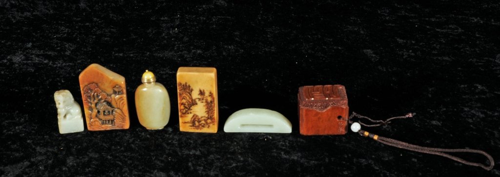 6 CHINESE CARVED JADE AND SOAPSTONE PIECES. CONSISTING: 6 CHINESE CARVED JADE AND SOAPSTONE PIECES. CONSISTING OF 3 JADE BOTTLES WITH FOO DOG, SWORD AND GOURD DECORATION. 3 SOAPSTONE CHOPS. GOOD. LG. 2 3/4" H X 1 3/4" W 3/4" D.