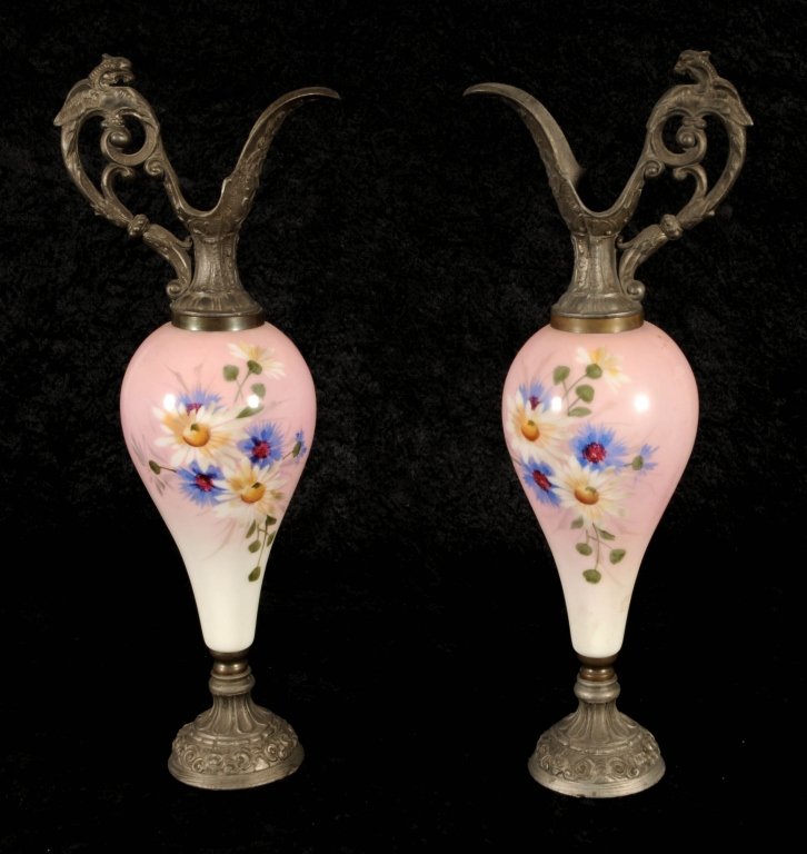 PR. ENGLISH BRISTOL GLASS & SPELTER EWERS. PINK TO: PR. ENGLISH BRISTOL GLASS & SPELTER EWERS. PINK TO WHITE BODY WITH MULTI COLOR FLORAL DESIGN. SPELTER SPOUTS AND BASES. GOOD. 18 1/2" H X 7" W X 4 3/4" D.