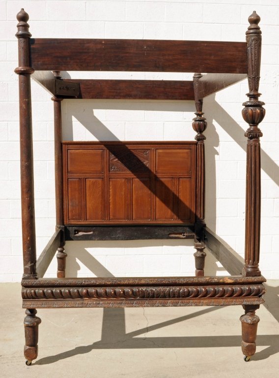 ANTIQUE ENGLISH FOUR POSTER BED. 2 CARVED FRONT: ANTIQUE ENGLISH FOUR POSTER BED. 2 CARVED FRONT COLUMNS, 2 TURNED BACK COLUMNS. CARVED BACK PANEL. LOWER LEGS AS IS. 92" H X 82" W X 64" D.