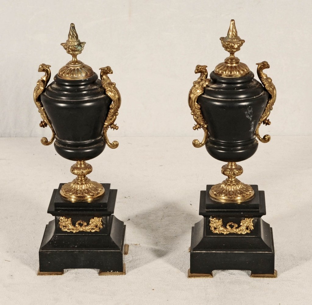 PAIR OF BLACK MARBLE URNS WITH ORMOLU MOUNTS. WINGED: PAIR OF BLACK MARBLE URNS WITH ORMOLU MOUNTS. WINGED GRIFFIN HANDLES. GOOD. 13" H X 4 1/2" W X 3 1/2" D.