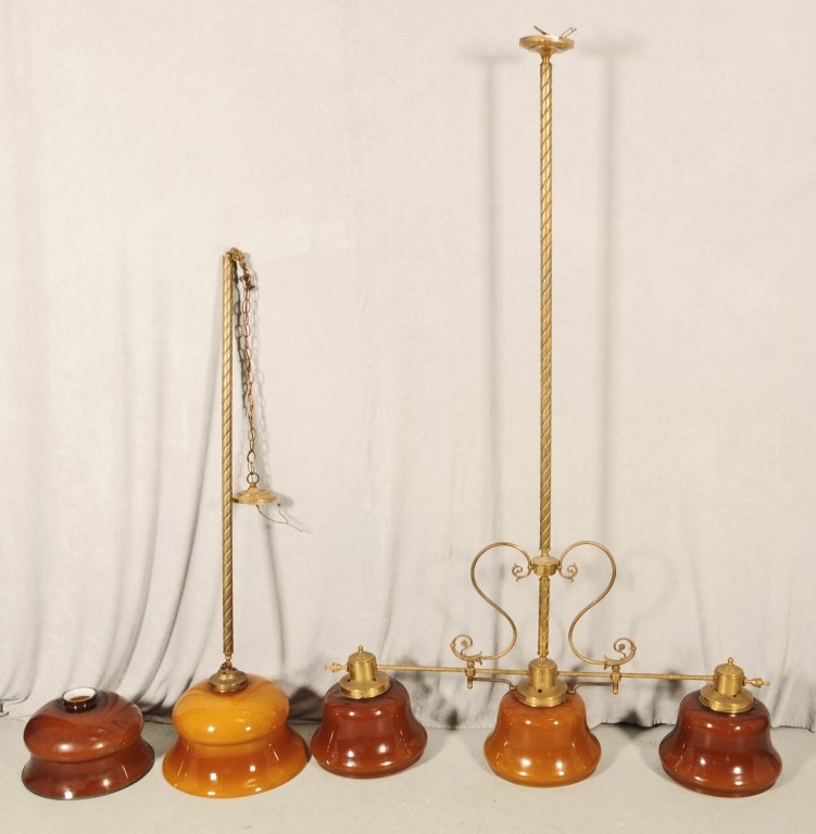 3 PC. CONSISTING OF A POOL TABLE CHANDELIER WITH 3: 3 PC. CONSISTING OF A POOL TABLE CHANDELIER WITH 3 LIGHTS & 3 SHADES, A SINGLE LIGHT FIXTURE (58" H) AND AND EXTRA SHADE (9" H X 15" DIA). CHANDELIER HAS BRASS MOUNTS WITH WHITE/AMBER GLASS SHADES. GO