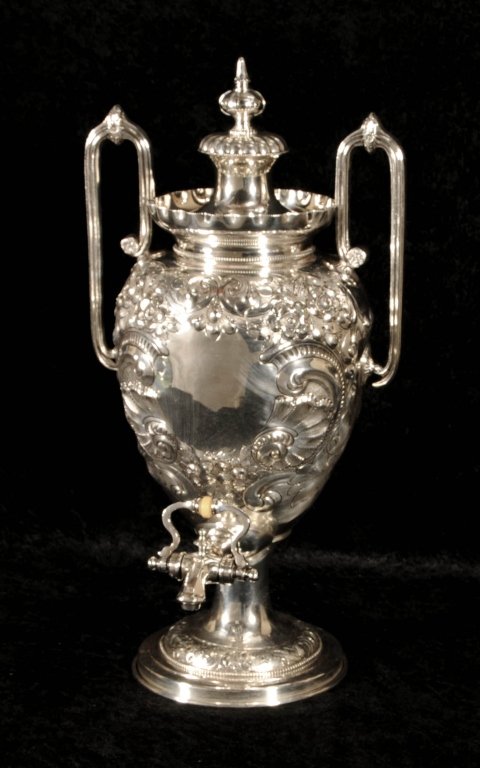 ANTIQUE ENGLISH SILVER PLATED COFFEE URN. "OLD PLATE".: ANTIQUE ENGLISH SILVER PLATED COFFEE URN. "OLD PLATE". TWO HANDLED WITH RAISED FLORAL DECORATION. GOOD. 20" H X 10 1/2" W.
