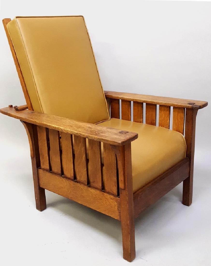 Circa 1915 (L & JG Stickley #471)Morris Chair with: Circa 1915 (L & JG Stickley #471)Morris Chair with Pegged construction. Mortise thru the wide arm. Old Refinish. H 40" w 32" d 35". Sound condition. New Upholstery. Found in Rochester MN.