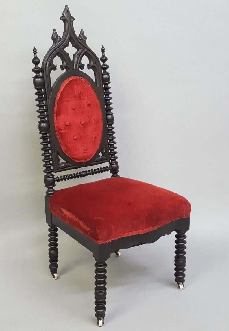 C 1850's American Rosewood Grained Gothic Chair with: C 1850's American Rosewood Grained Gothic Chair with original porcelain castors. H 47" w 19" d 21". Good original finish and condition is solid. Found in Galesville WI estate.