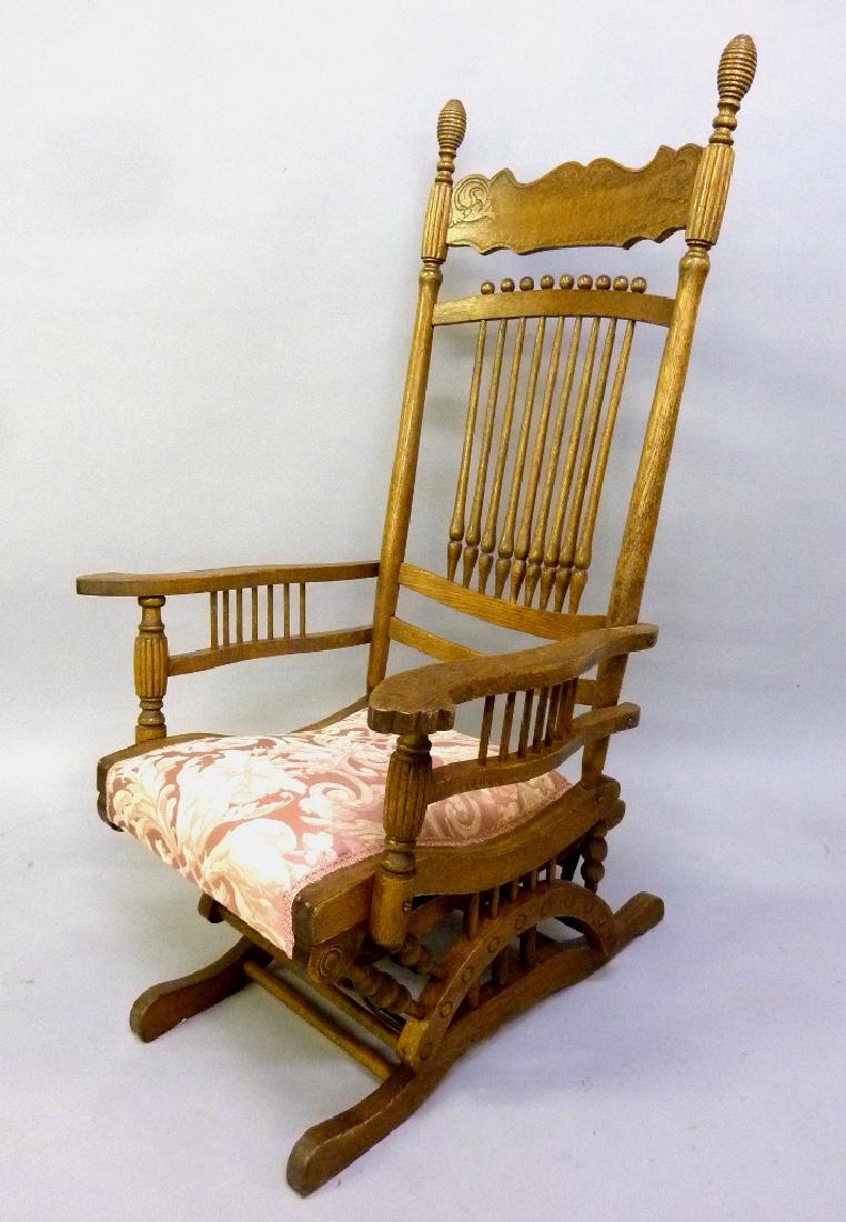 Circa 1890 Solid Oak Carved Gliding Rocker h 48" w