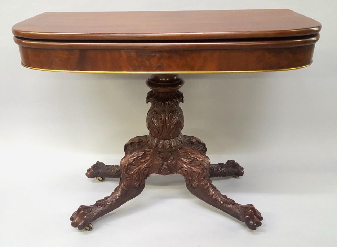 Circa 1825 New York Classical Game Table with Brass: Circa 1825 New York Classical Game Table with Brass lower front molding and acanthus and leaf carved legs ending in paw feet. Great high style folding gaming table. Hgt 29" w 36" d 18".