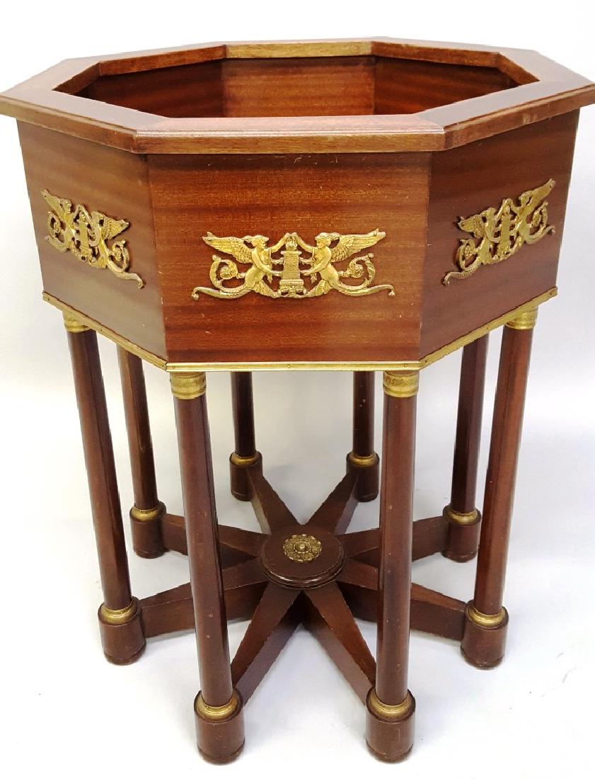 Circa 1920's Empire-Style Mahogany Planter with cast: Circa 1920's Empire-Style Mahogany Planter with cast ormolu capitals & classical design on each side. Hgt 32" W 25". Good condition.