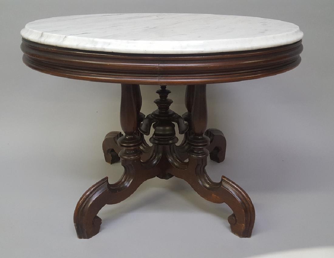 Circa 1870's Oval Walnut Marble Top Coffee Table - very: Circa 1870's Oval Walnut Marble Top Coffee Table - very nice solid walnut table with original finish and marble if very good condition. Hgt 19" width 27" depth 22.5". Found in Ellsworth WI estate.