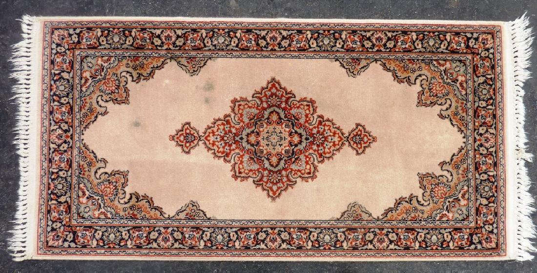 Signed Karastan Machine Made Oriental Rug - 55" x 26".: Signed Karastan Machine Made Oriental Rug - 55" x 26". Label on the back. beige, rust, black.