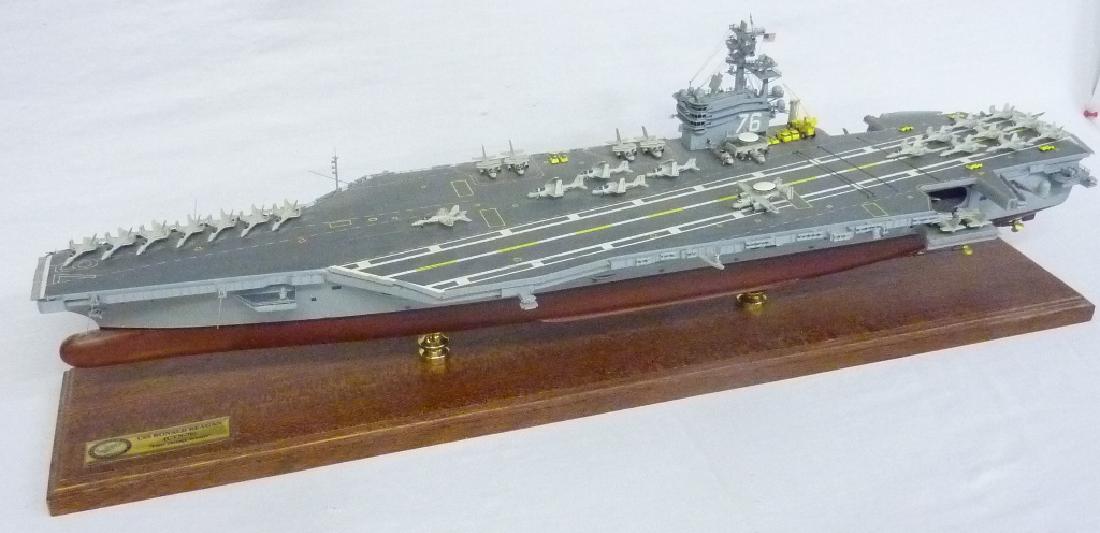 Hand made model of USS Ronald Reagon aircraft carrier -: Hand made model of USS Ronald Reagon aircraft carrier - L 31" w 9" w 9 - The main body of this model is paint decorated wood. Very good condition. Comes in custom built crate for moving. From Mantorvi