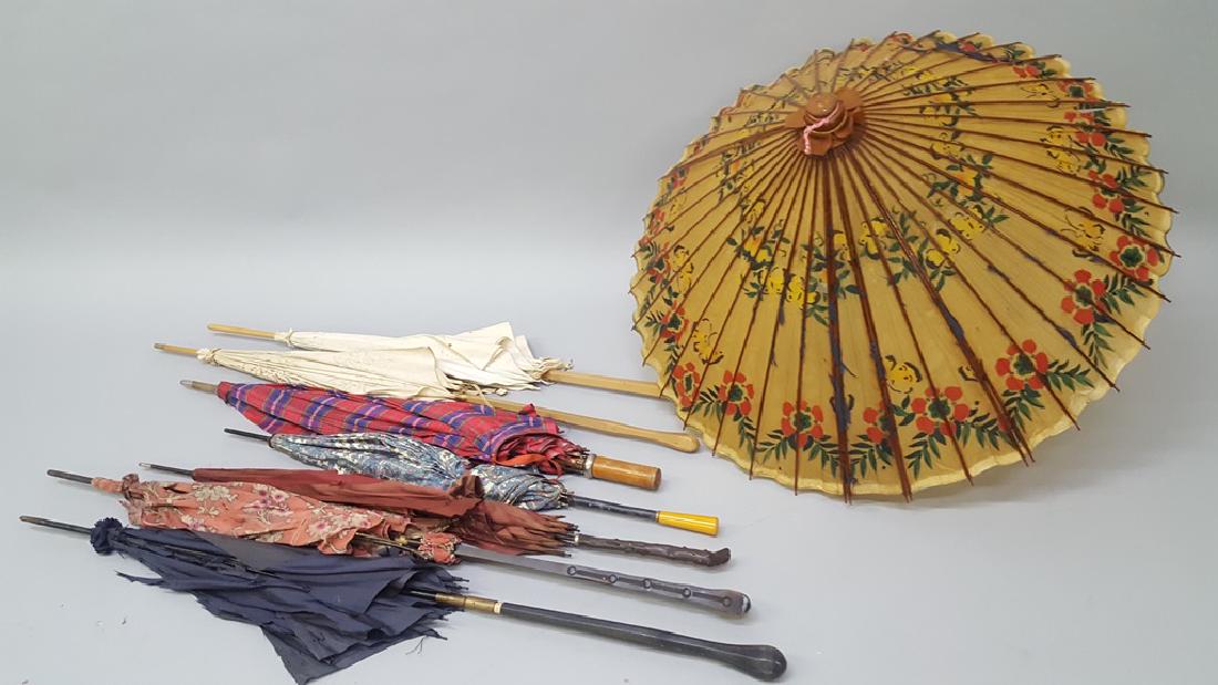 Collection of 8 antique umbrellas with carved wood: Collection of 8 antique umbrellas with carved wood shafts, bakalite handle, plus an oriental design. Longest 42" shortest. 26". From Galesvill WI 150 year old estate.
