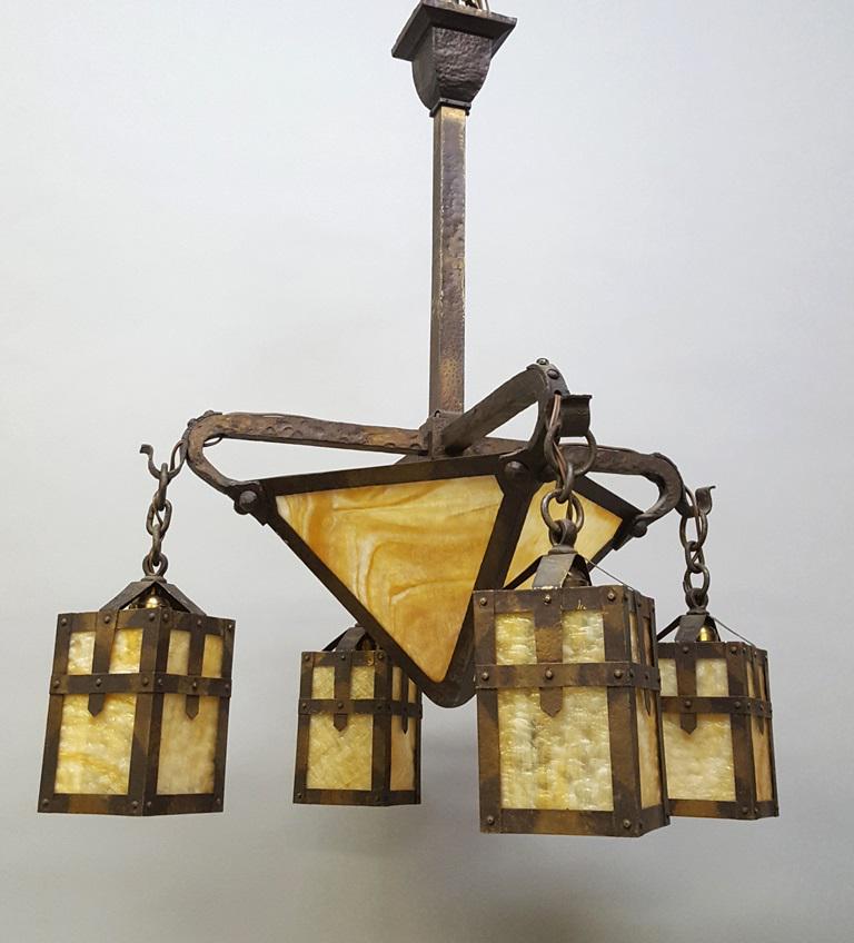 Circa 1920 Hand Hammered Mission Ceiling Fixture - has: Circa 1920 Hand Hammered Mission Ceiling Fixture - has carmel center dome plus 4 outside carmel slag shades- all patinated brass frame - hgt 34.5" width 20". All rewired ready to hang. Very good condi