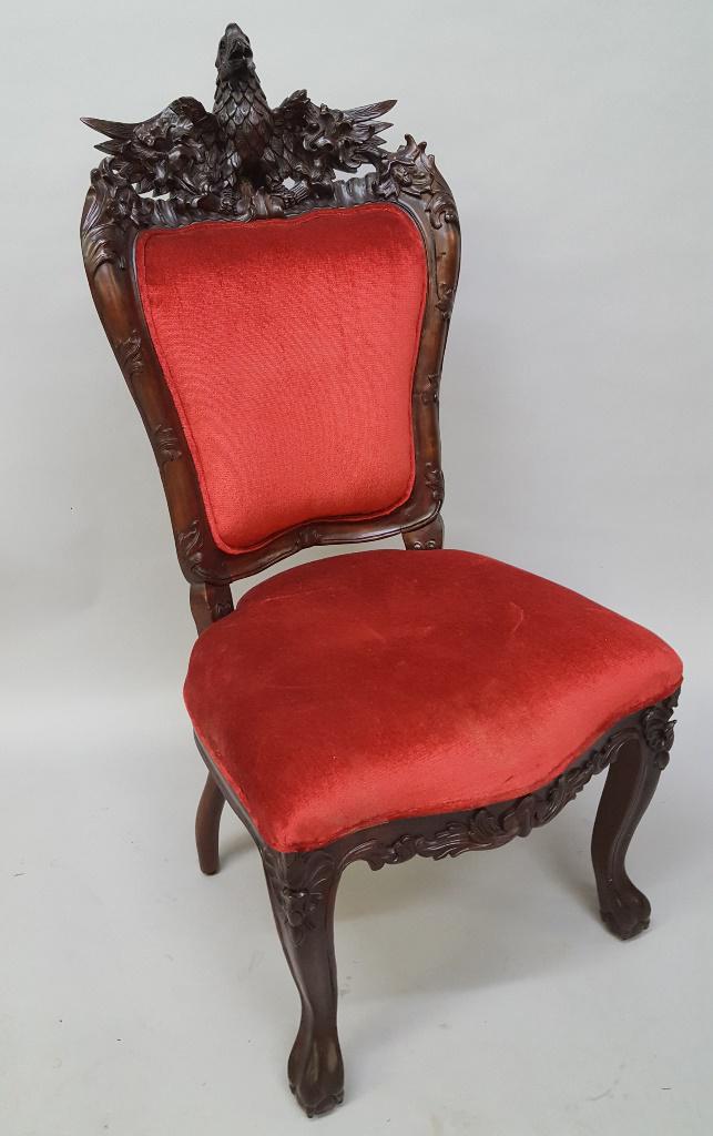 Heavily Carved Mahogany Chair with Bird resting on: Heavily Carved Mahogany Chair with Bird resting on the Back of the chair - hgt 48" width 22" depth 28", Very good condition. Found in Minnnetonka MN estate.