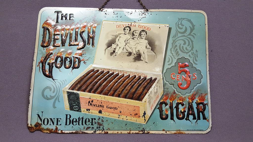 Circa 1920's Tin sign (The Devlish Good 5 Cents: Circa 1920's Tin sign (The Devlish Good 5 Cents Cigar-None Better signed by Wolf & Co Selling Agents--Enne Green New York. Hgt 10" width 13.75".