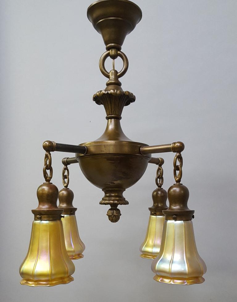 C 1920's Four Arm Chandelier with signed Quezal Shades: C 1920's Four Arm Chandelier with signed Quezal Shades - h 26" dia. 20". No cracks or chips. All shades are signed. Rewired ready to hang. Found in Nelson WI home.