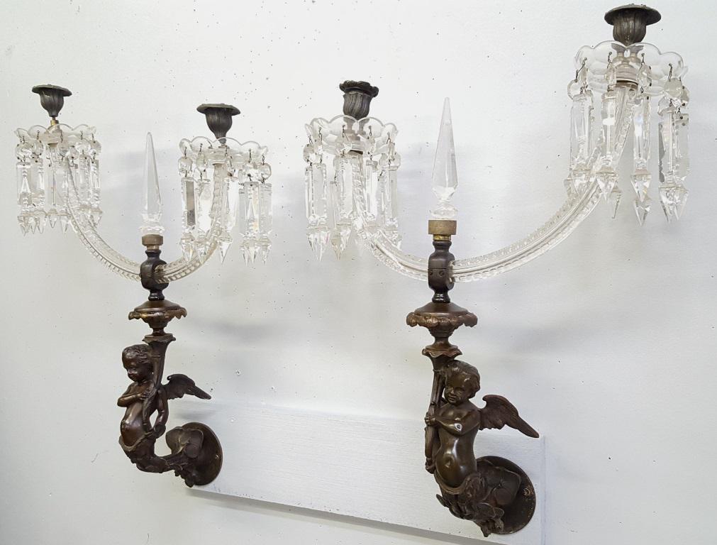 C 1880's Solid Bronze Winged Putti w/Cut Glass Candle: C 1880's Solid Bronze Winged Putti w/Cut Glass Candle Arms - super high quality bronze & cut glass wall sconces bought in Haverhill MA in the 1970s. Glass and bronze in good condition. Hgt 23.5" w 16"
